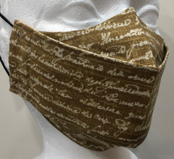 Cream Cursive text on a peanut base mask