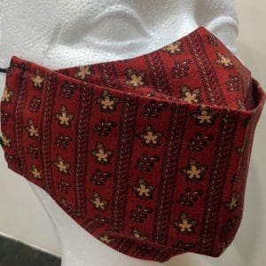 Burgundy base zipper-like strips beige/cream leaves mask