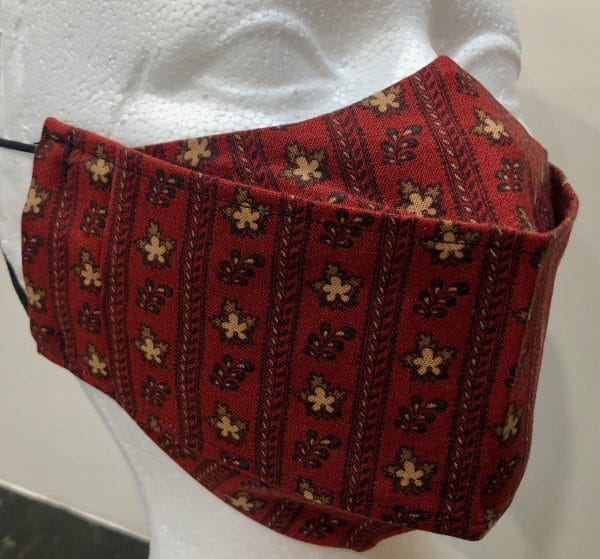 Burgundy base zipper-like strips beige/cream leaves mask