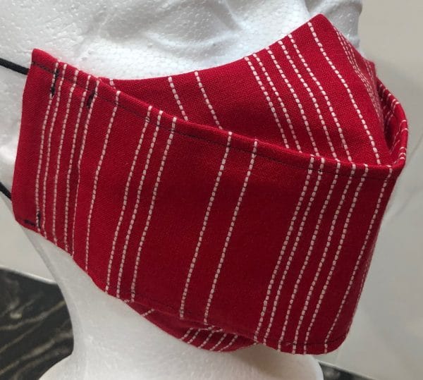 Red base with raised white dotted stripes mask