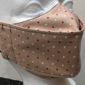 Mini cream and dark salmon dots on light salmon mask