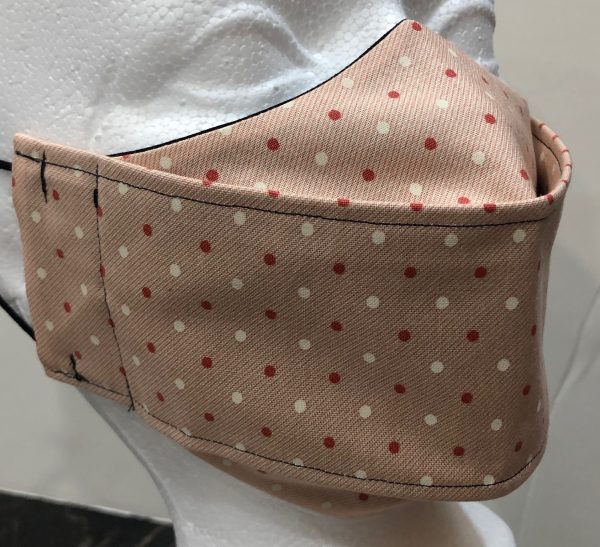 Mini cream and dark salmon dots on light salmon mask